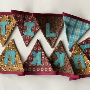 Bunting with text "TIL LUKKU" / Vimpul við teksti