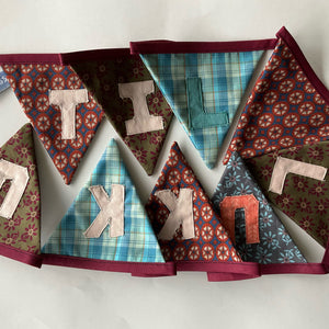 Bunting with text "TIL LUKKU" / Vimpul við teksti